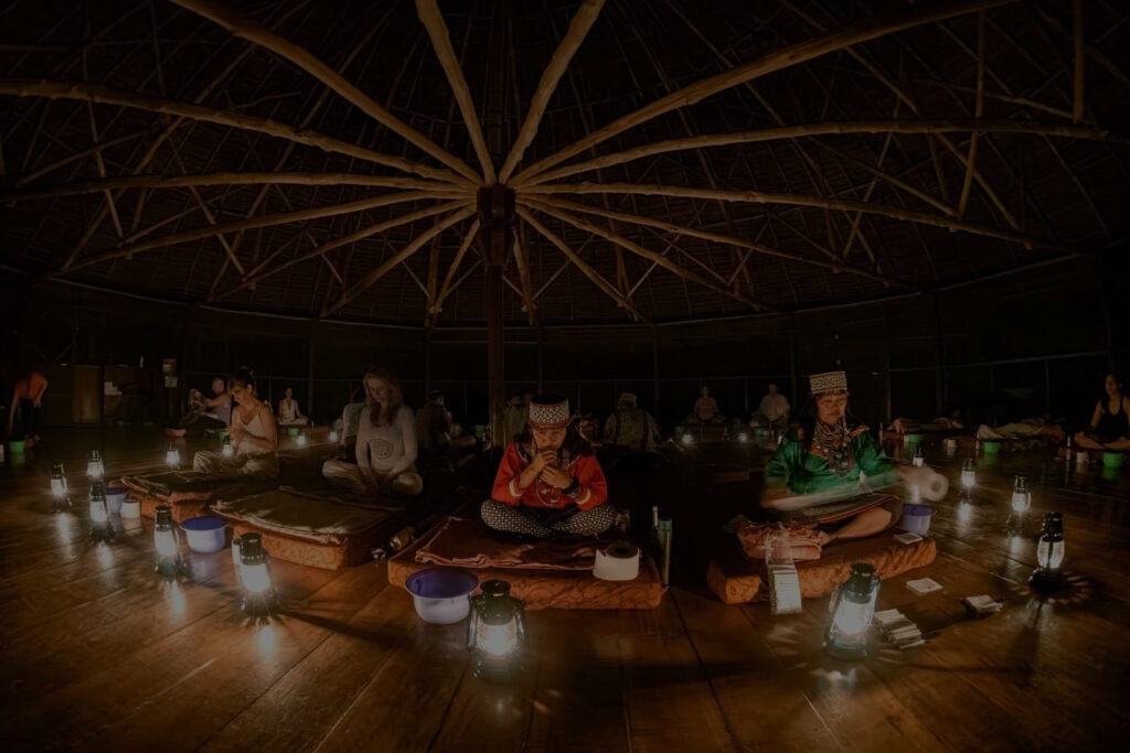 Participant sitting quietly preparing for ayahuasca ceremony